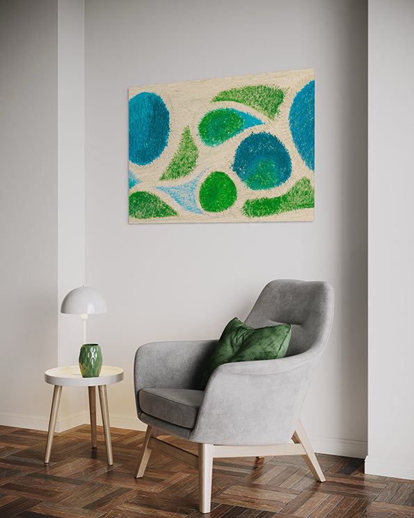 abstract artwork depicting aerial view of a beach with sand and grass shrubs and pools of water with shaky brush strokes making it seem wind swept. Abstract wall art hanging in living room above a grey armchair