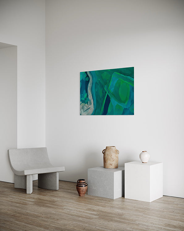 wall art print, artwork depicting an aerial view of the earth as it intersects with rivers and estuaries. Artwork has greens and blues in varying tones. Artwork hanging in living room.