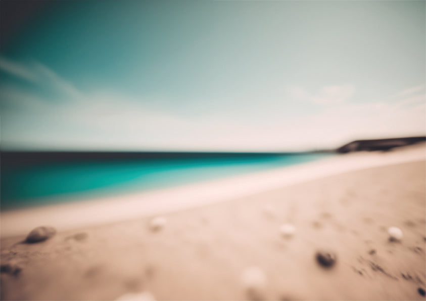 Shell Cove unique wall art print, blurred shoreline with shells and aqua water against a soft blue sky.