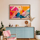 abstract wall art tilted hanging in living room hanging above unit.  artwork described as bright colours and lines in geometric shapes overlapping to form a visually pleasing artwork. 