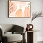 after the rain botanical wall art.  soft pastel colours of apricot and blush pink combined with painted leaves and rain drops create a beautiful and unique abstract nature based artwork. artwork is hanging in a high quality canvas timber float frame above a lounge chair in a designer home.