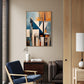 Modern living room with abstract wall art, chair, and sofa.