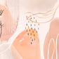 after the rain botanical wall art.  soft pastel colours of apricot and blush pink combined with painted leaves and rain drops create a beautiful and unique abstract nature based artwork.