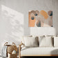 abstract artwork, brown and orange and black shapes and lines, unique wall art print in lounge room hanging on the wall above a white lounge