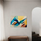 Printable wall art, bright colours and geometric shapes, looks like folded paper, wall art print hanging in living room.