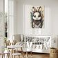 kids wall art baby bunny illustration surrounded by colourful earthy flowers.  Wall Art print hanging in kids room above a white bed