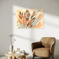 botanical wall art print, orange and brown leaves with apricot coloured background, botanical wall art print hanging in living room above armchair and coffee table