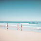 Beach Day a unique wall art print featuring a blurred beach scene.  Waves crash whilst people watch from the sand. 