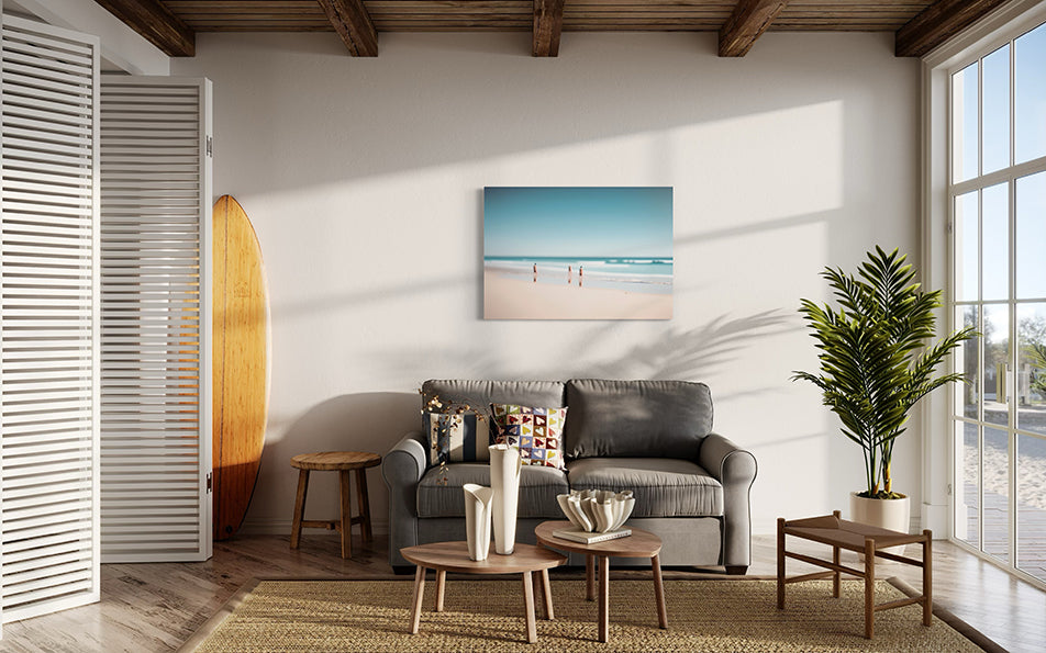 Beach Day a unique wall art print featuring a blurred beach scene.  Waves crash whilst people watch from the sand.  Wall art print hanging in living room.