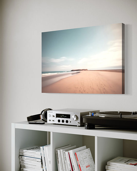 coastal connection unique wall art print featuring shoreline and rocky headland in the distance. wall art canvas hanging in living room.