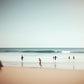 Joyful moments unique wall art print with muted beach scene with children running on the waters edge. 