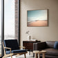 Australian wall art canvas float frame in living room hanging above armchair and lounge.
