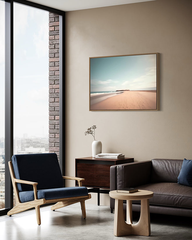 Australian wall art canvas float frame in living room hanging above armchair and lounge.