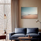 Australian wall art in canvas float frame in Modern living room with a blue sofa, wooden coffee table, and a large window.