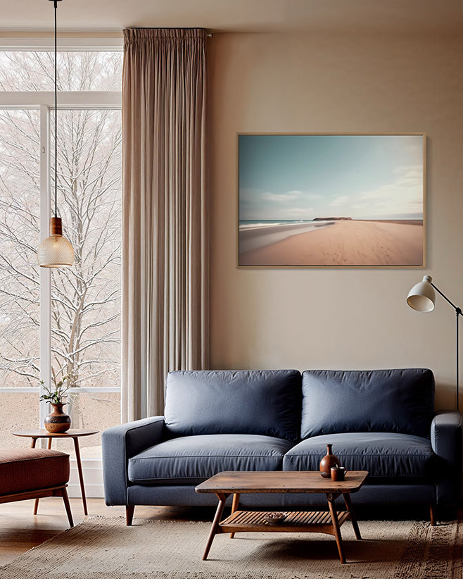 Australian wall art in canvas float frame in Modern living room with a blue sofa, wooden coffee table, and a large window.