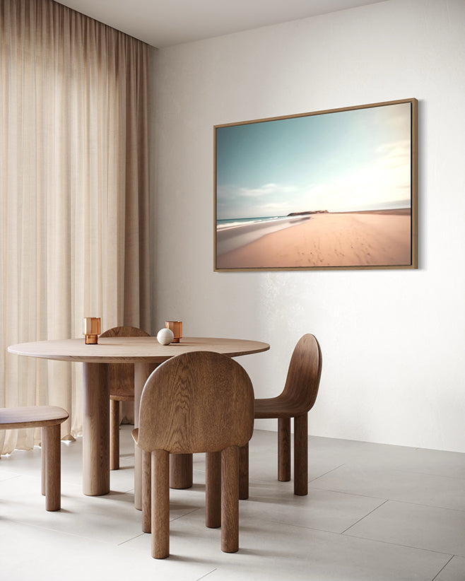 Australian wall art in canvas float frame hanging in a high end living room above a dining table and chairs.